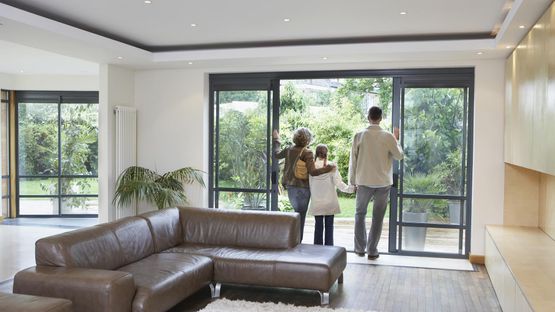 A family stood near there new bi-folding door